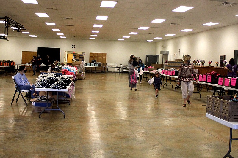 <p>SERVE, Inc. had mountains of shoes and clothes to give away Saturday at Callaway Christian Church. The items, donated by Dollar General Distribution Center, were free to anyone in need of children’s spring and summer attire.</p>