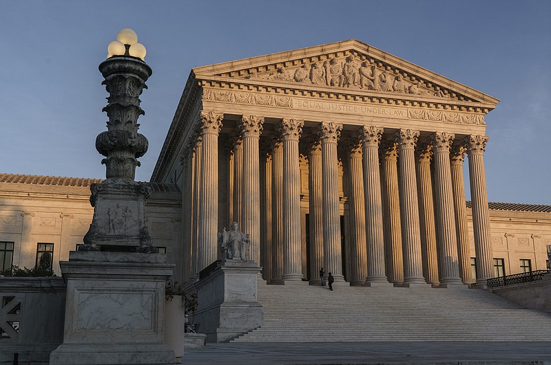 FILE - In this Nov. 6, 2020, file photo, the Supreme Court is seen at sundown in Washington. The Supreme Court is telling California that it can’t enforce coronavirus-related restrictions that have limited home-based religious worship including Bible studies and prayer meetings.The order from the court late Friday, April 9, 2021, is the latest in a recent string of cases in which the high court has barred officials from enforcing some coronavirus-related restrictions applying to religious gatherings. (AP Photo/J. Scott Applewhite, File)