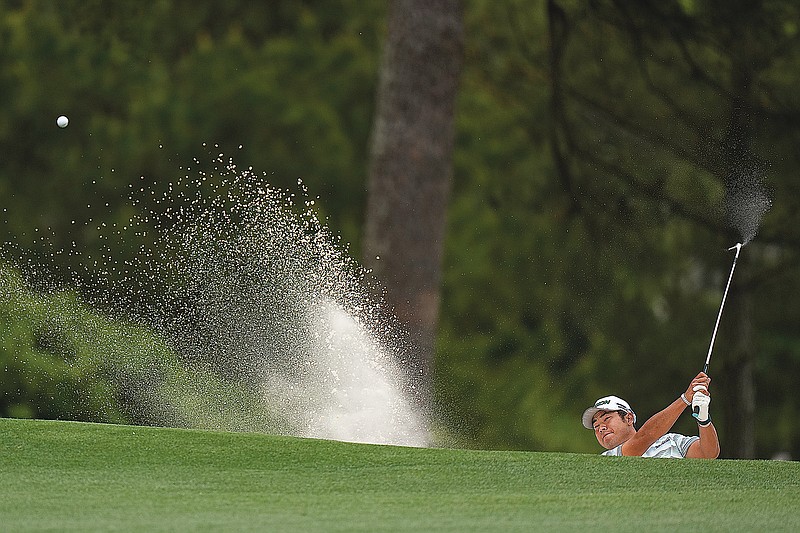 Hideki Matsuyama hits out of a bunker on the first hole during Saturday's third round of the Masters in Augusta, Ga.