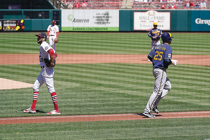 Cardinals starting pitcher Daniel Ponce de Leon walks off the mound after giving up a bases-loaded walk to Brewers pitcher Brett Anderson during the first inning of Sunday afternoon's game at Busch Stadium.