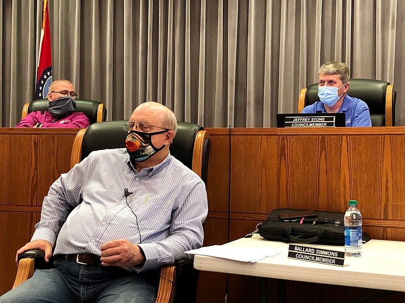 City Director of Administration Bill Johnson, back, left listens to Ward 2 Councilperson Jeff Stone as Ward 1 Councilperson Ballard Simmons also listens in the foreground during the Fulton City Council's March 23 meeting in council chambers at Fulton City Hall.