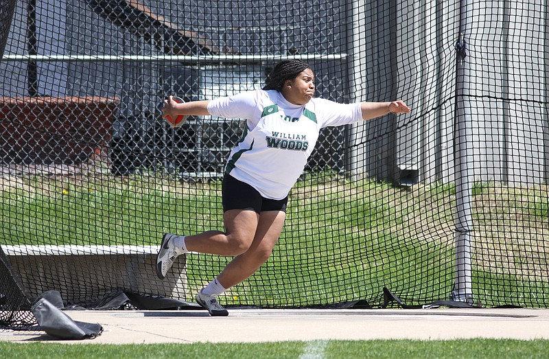 William Woods senior Ananiah Talton spins before throwing the discus during Sunday's Lincoln Open. The track events were held at Lincoln University's Dwight T. Reed Stadium, but some field events, such as the women's discus, took place at Jefferson City High School's Adkins Stadium.