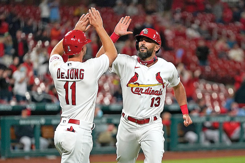 Matt Carpenter is congratulated by Cardinals teammate Paul DeJong after hitting a two-run home run during the third inning of Tuesday's game against the Nationals at Busch Stadium.