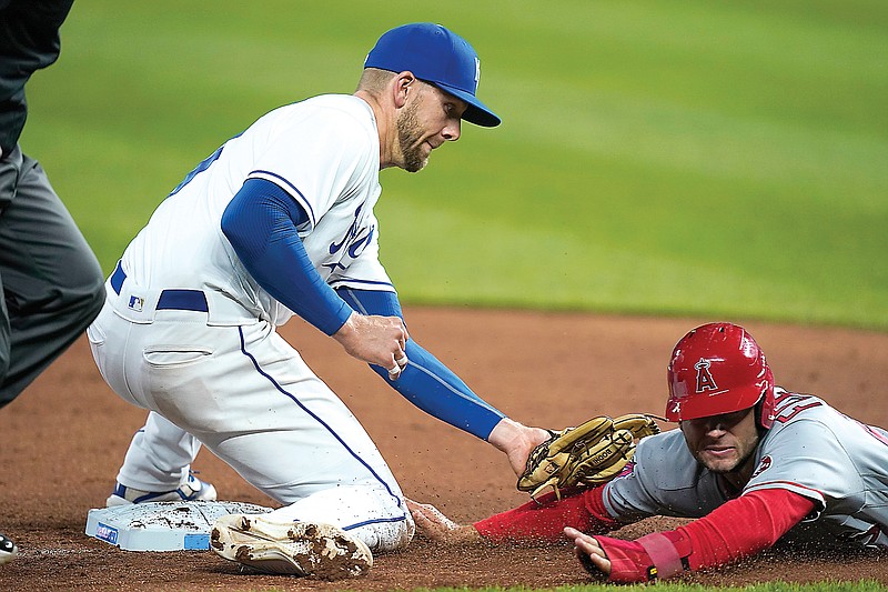 Angels baserunner David Fletcher (right) is tagged out by Royals third baseman Hunter Dozier during the ninth inning of Tuesday's game at Kauffman Stadium.