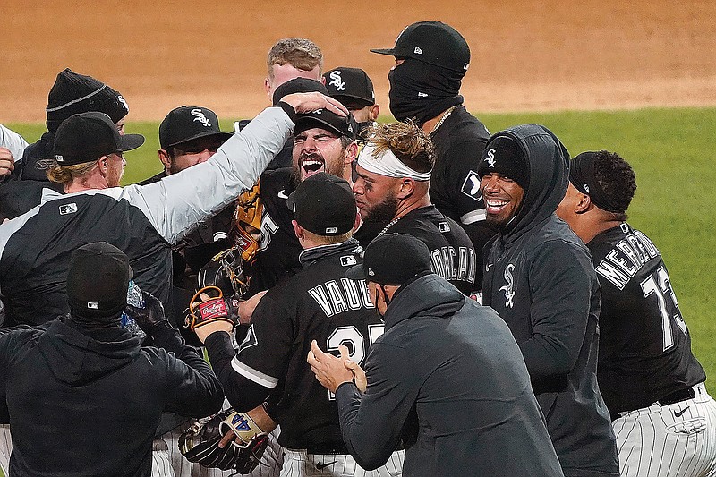 White Sox starting pitcher Carlos Rodon (center) celebrates his no-hitter against the Indians with his teammates Wednesday night in Chicago.