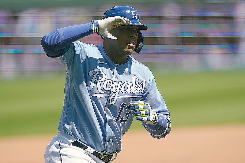 Salvador Perez of the Royals gestures while rounding the bases after hitting a solo home run during the third inning of Wednesday afternoon's game against the Angels at Kauffman Stadium.