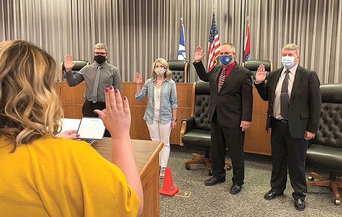From left, Alan Combs, of Ward 3; Lauren EH Nelson, of Ward 4; Mike West, of Ward 1; and incumbent Jeffrey Stone, of Ward 2, are sworn in Tuesday by City Clerk Courtney Doyle prior to the Fulton City Council's meeting at Fulton City Hall.