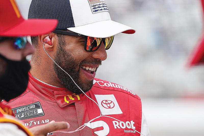 Bubba Wallace laughs before a NASCAR Cup Series race last month at Atlanta Motor Speedway in Hampton, Ga.