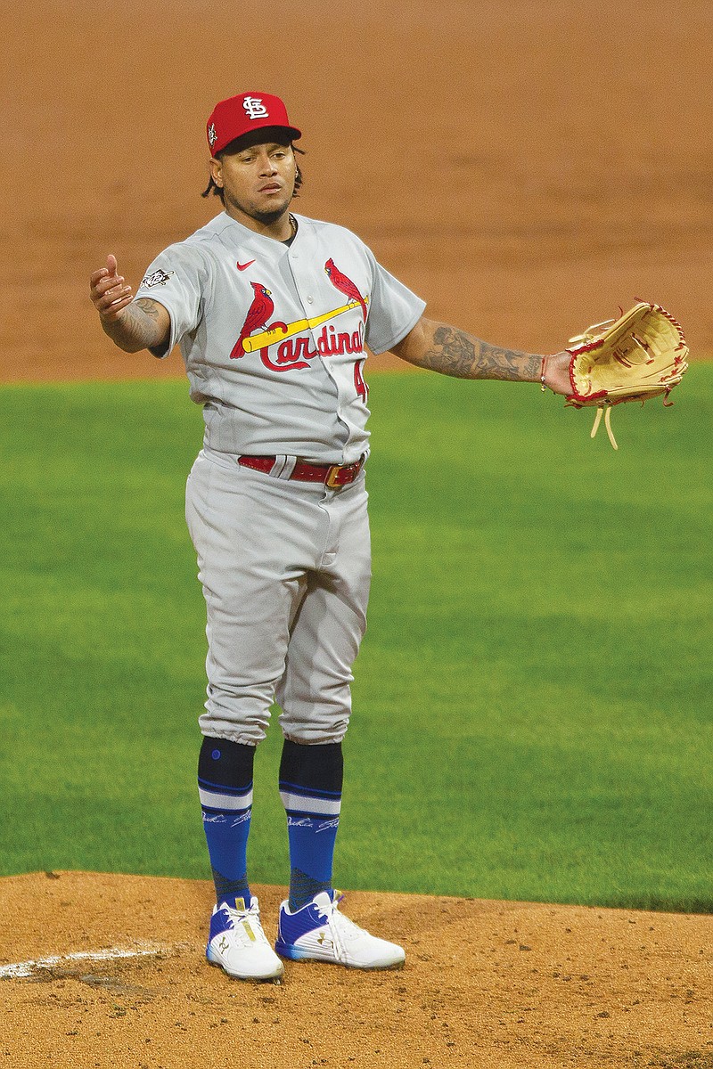 Cardinals pitcher Carlos Martinez gestures after Alec Bohm of the Phillies scored on a single during the second inning of Friday night's game in Philadelphia.