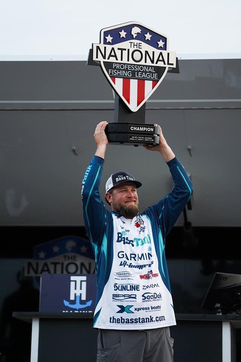 John Soukup of Sapulpa, Oklahoma, raises his first-place trophy after winning the inaugural National Professional Fishing League tournament on March 13 at Lake Eufuala in Alabama. (Submitted photo)
