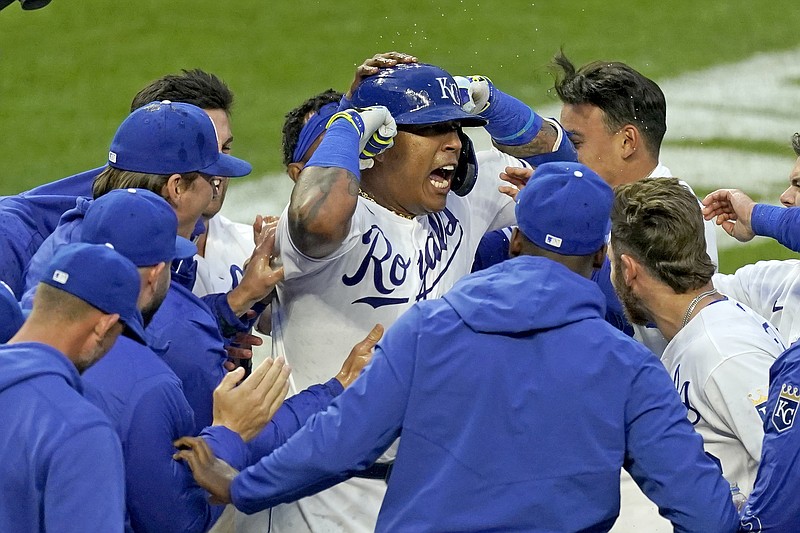 Salvador Perez celebrates with his Royals teammates after hitting a walk-off home run to win the second game of Saturday's doubleheader against the Blue Jays at Kauffman Stadium.