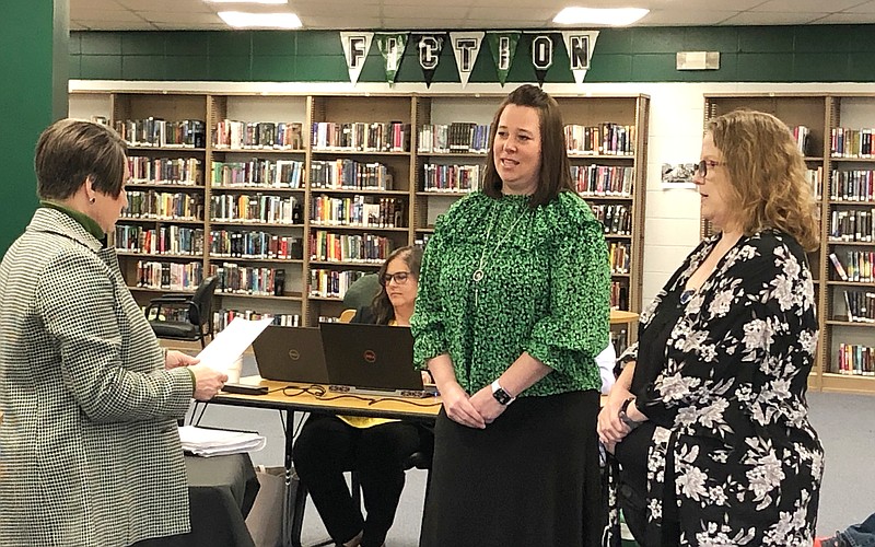 Incumbent Amy Reinhard, middle, and newcomer Rebecca Wall, right, are sworn in by Superintendent Nicky Kemp during the North Callaway R-1 Board of Education meeting Thursday night in the high school media center.