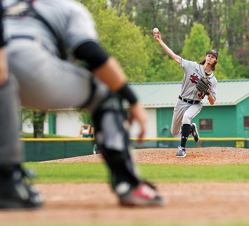 Wyatt Fischer of Jefferson City rounds third base on his way to scoring a run as coach Kyle Lasley gives instructions Saturday during a Columbia Tournament game against Rolla at Vivion Field.