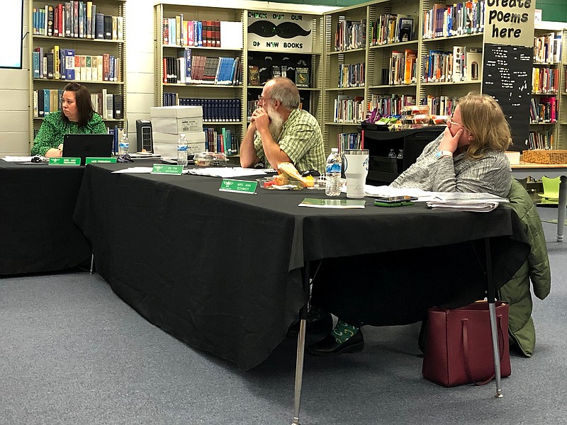 From left, North Callaway R-1 Board of Education members Amy Reinhard, Dr. Tim Safranski and Amy Schmidt listen to a report by Superintendent Nicky Kemp (not pictured) during Thursday night's meeting in the high school media center in Kingdom City.