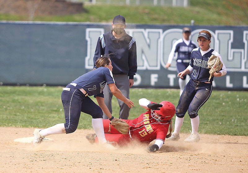 Lincoln shortstop Jordan Hollon (left) tags out Pittsburg State's Paxtyn Hayes at second base during the third inning in the second game of Sunday's doubleheader against Pittsburg State at LU Softball Field.