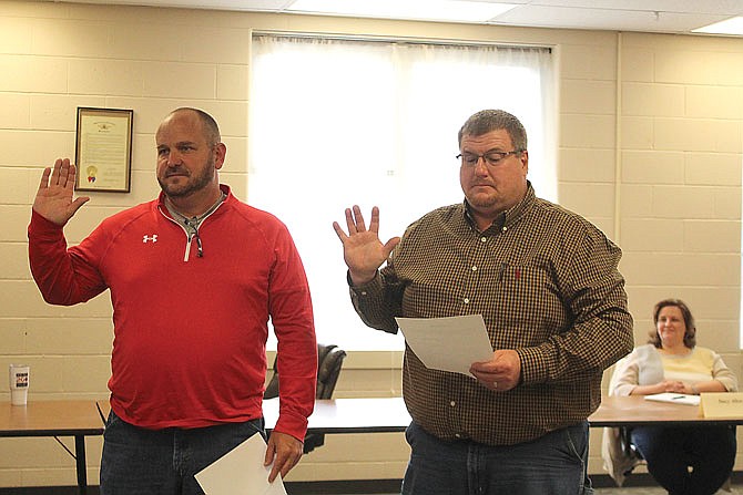 School board members Craig Abbott and Doug Glick join the New Bloomfield R-3 Board of Education during Tuesday night's meeting.