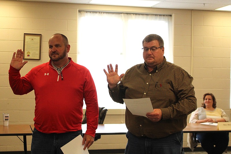 <p>Olivia Garrett/For the News Tribune</p><p>School board members Craig Abbott and Doug Glick join the New Bloomfield R-3 Board of Education during Tuesday night’s meeting.</p>