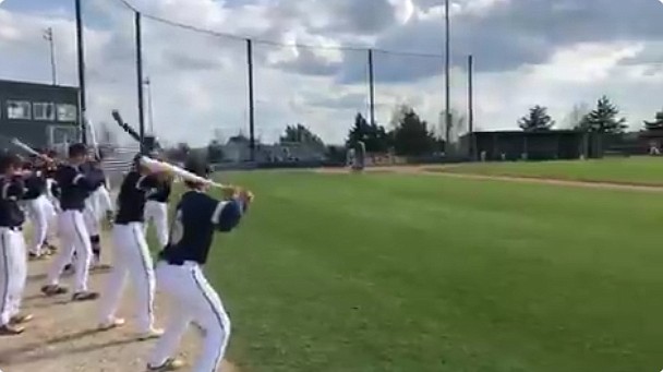 Baseball players warm up in advance of the Helias Crusaders hosting Rock Bridge April 21, 2021, in Jefferson City.