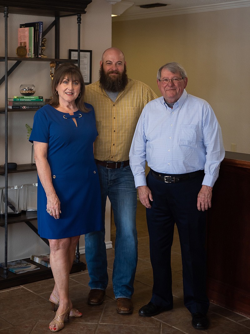 Century 21 All Points Realty is owned by Jared Horton, center, and Pete Snow, right, who also serve as the agency's brokers. Claudia Snow, left, is one of 21 agents in the real estate firm. Century 21 All Points' brokers and agents are devoted to their clients' needs.