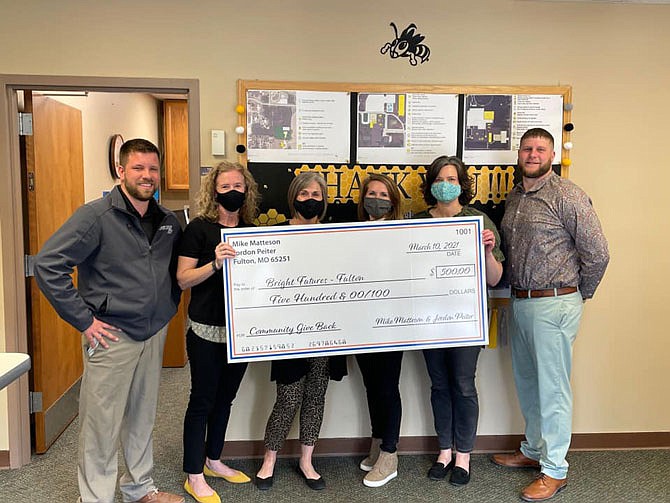 Bright Futures received a donation from Jordan Peiter, of Fulton Ford, and Mike Matteson, of Fulton Chrysler Dodge Jeep Ram, in March. The program connects community organizations and individuals with student needs.