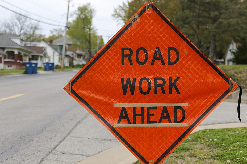 Liv Paggiarino/News TribuneA road work sign stands Friday in a neighborhood along Bald Hill Road. National Work Zone Safety Awareness Week starts next week, and is about reminding drivers to drive slowly and cautiously in work zones.