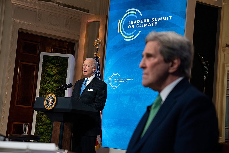 Special Presidential Envoy for Climate John Kerry listens as President Joe Biden speaks to the virtual Leaders Summit on Climate, from the East Room of the White House, Friday, April 23, 2021, in Washington. (AP Photo/Evan Vucci)