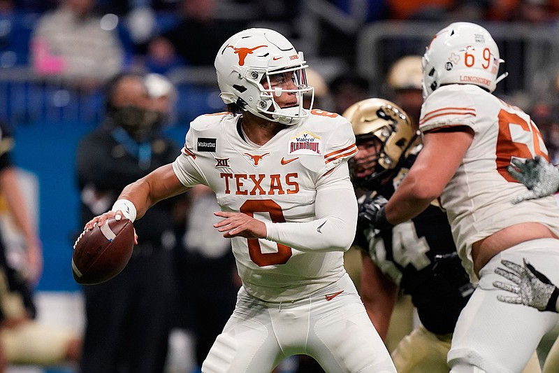 Texas quarterback Casey Thompson (8) looks to pass during the second half of the Alamo Bowl NCAA college football game against Colorado  in San Antonio, in this Tuesday, Dec. 29, 2020, file photo. Casey Thompson's Alamo Bowl performance made him look like an easy pick to be starting quarterback at Texas in 2021. But a coaching change from Tom Herman to Steve Sarkisian and the ripe talent of backup Hudson Card has made Saturday's spring scrimmage, and the months leading into the 2021 season, all about one position and who be the starter against Louisiana on Sept. 4. (AP Photo/Eric Gay, File)