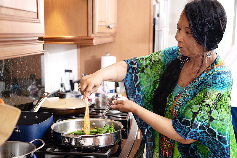 Regina Mitchell prepares a meal inside her kitchen at her private residence on Tuesday, March 31, 2020, in Henderson, NV. Mitchell, who lost her sight quite suddenly 7 years ago, continues to dominate in the kitchen and now teaches cooking classes over Zoom to others who have visual impairments. (Mariah Tauger/Los Angeles Times/TNS)