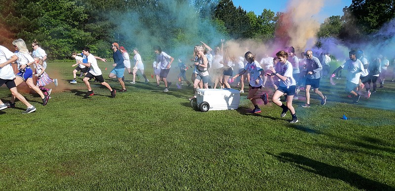 More than 200 people ranging in age from 5 to 60-plus thunder forth through clouds of color to race to the finish in CASA's Colorful 5K Run on Saturday in Texarkana. Their fundraising goal of about $10,000 was met.
