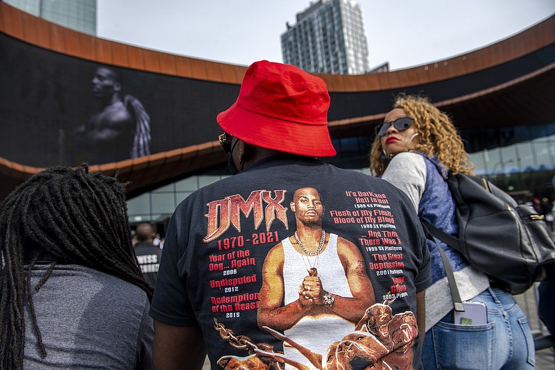 People gather for a "Celebration of Life Memorial" for rapper DMX at Barclays Center, Saturday, April. 24, 2021, in the Brooklyn borough of New York. DMX, whose birth name is Earl Simmons, died April 9 after suffering a "catastrophic cardiac arrest."  (AP Photo/Brittainy Newman)