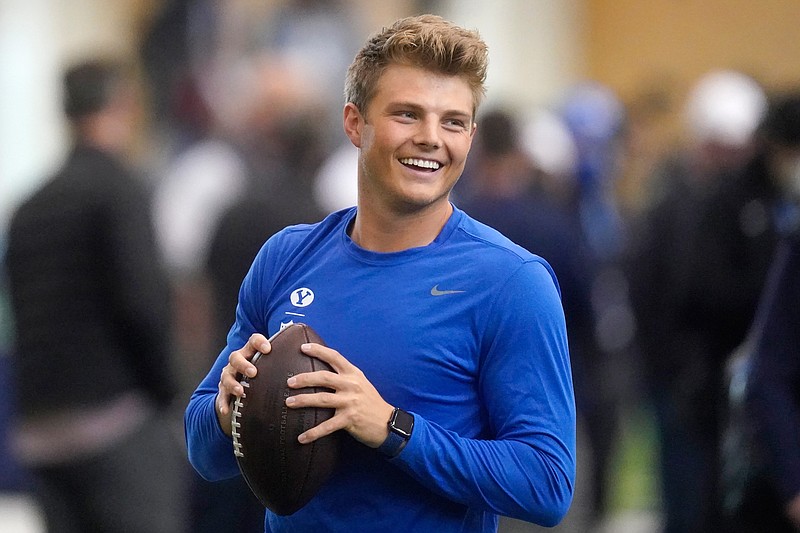 FILE - BYU quarterback Zach Wilson warms up before participating in the school's pro day football workout for NFL scouts  in Provo, Utah, in this Friday, March 26, 2021, file photo.  Wilson is expected to be a first round pick in the NFL Draft, April 29-May 1, 2021, in Cleveland. (AP Photo/Rick Bowmer, File)