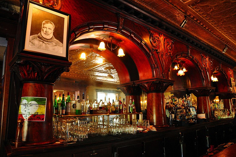 A portrait of Ernest Hemingway looks down from the mahogany bar at City Park Grill in Petoskey, Michigan. (Katherine Rodeghier/Chicago Tribune/TNS)