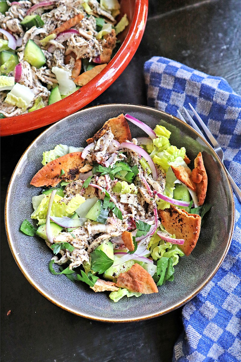 Fattoush is a chopped Levantine salad made with stale pita. This includes shredded chicken tossed in a citrusy tahini-sumac dressing. 