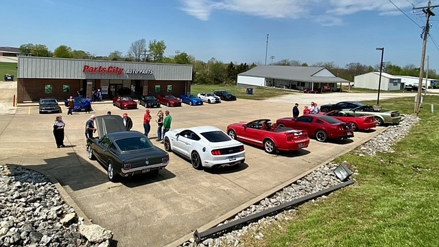 Members of the Central Missouri Mustang and Ford Club take a break during their 2021 National Mustang Day cruise on Apr. 24.