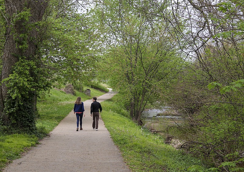 Liv Paggiarino/News Tribune

People walk along the Greenway Bike Trail on Wednesday before the rain sets in for the afternoon in Jefferson City. 