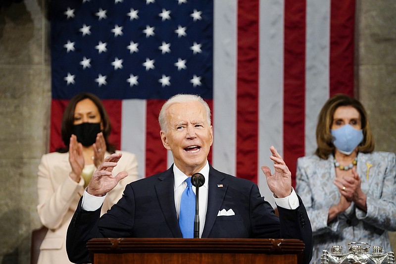 Vice President Kamala Harris, and House Speaker Nancy Pelosi of Calif., stand and applaud as President Joe Biden addresses a joint session of Congress, Wednesday, April 28, 2021, in the House Chamber at the U.S. Capitol in Washington. (Melina Mara/The Washington Post via AP, Pool)