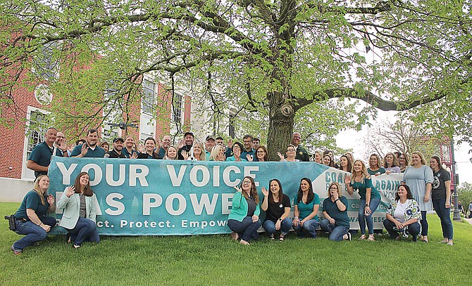 Community members gathered Wednesday in front of the Callaway County Courthouse in Fulton for a drone video to show their support for victims of sexual assault. The Coalition Against Rape and Domestic Violence encouraged locals to wear jeans as part of sexual assault awareness month and to fight back against victim blaming.