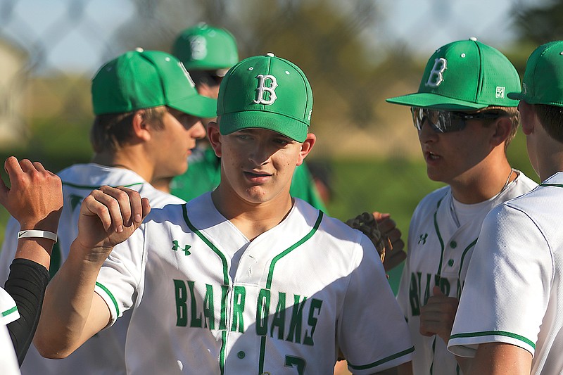 Blair Oaks pitcher Wil Libbert bumps fists with teammates after closing out an inning during Thursday's game against Southern Boone at the Falcon Athletic Complex in Wardsville. Libbert pitched a no-hitter into the seventh inning, as the Falcons defeated the Eagles 4-1.