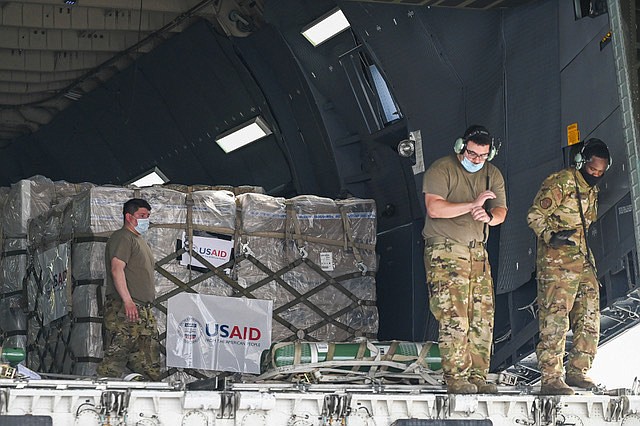 Relief supplies from the United States in the wake of India's COVID-19 situation arrive at the Indira Gandhi International Airport cargo terminal in New Delhi, India, Friday, April 30, 2021. (Prakash Singh/Pool via AP)