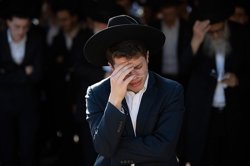 Ultra-Orthodox Jews mourn during the funeral of Moshe Ben Shalom at a cemetery in Petah Tikva, Israel, Friday, April 30, 2021.  Moshe Ben Shalom and several others died and others were injured during a stampede at Lag BaOmer celebrations, a religious festival attended by tens of thousands of ultra-Orthodox Jews in Mt. Meron, northern Israel early Friday. It was one of the country's deadliest civilian disasters (AP Photo/Oded Balilty)