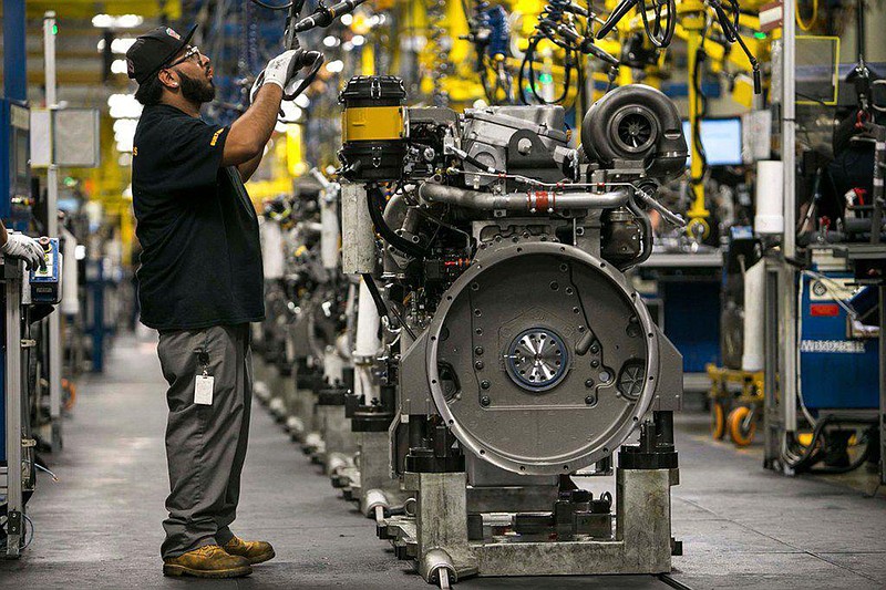 An employee works on an engine at Caterpillar's engine manufacturing plant in Seguin last year. (Dallas Morning News/TNS)