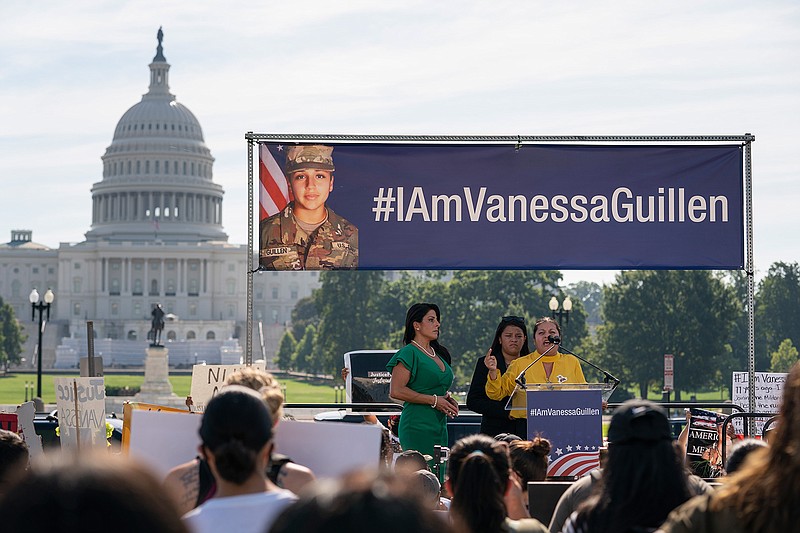 In this July 30, 2020, file photo slain Army Spc. Vanessa Guillen's mother Gloria Guillen, right, joined by Vanessa's sister Lupe Guillen, center, and family attorney Natalie Khawam, speaks as she cries during a news conference on the National Mall in front of Capitol Hill in Washington. The Army said Friday, April 30, 2021, that it has taken disciplinary action against 21 officers and non-commissioned officers at Fort Hood, Texas, in connection with death last year of Spc. Vanessa Guillen, who was missing for about two months before her remains were found. (AP Photo/Carolyn Kaster, File)