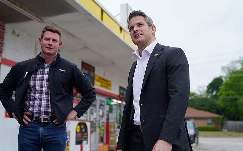 Rep. Adam Kinzinger, R-Ill., right, stands with Texas congressional candidate Michael Wood after they met for lunch, Tuesday, April 27, 2021, in Arlington, Texas. Wood is considered the anti-Trump Republican Texas congressional candidate that Kinzinger has endorsed in the May 1st special election for the 6th Congressional District. (AP Photo/LM Otero)