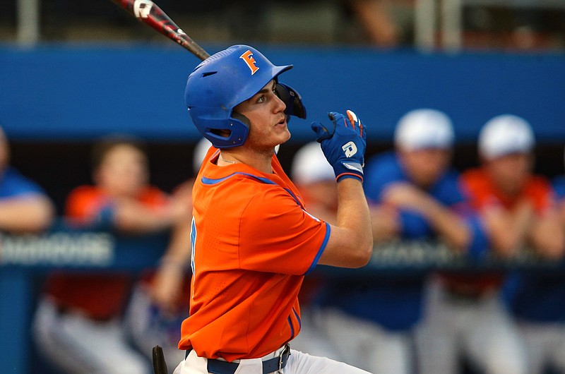 FILE - Florida outfielder Jud Fabian bats during an NCAA college baseball game against Florida A&M in Gainesville, Fla., in this Wednesday, March 4, 2020, file photo. Fabian is tied for second in the nation with 16 home runs. (AP Photo/Gary McCullough, File)
