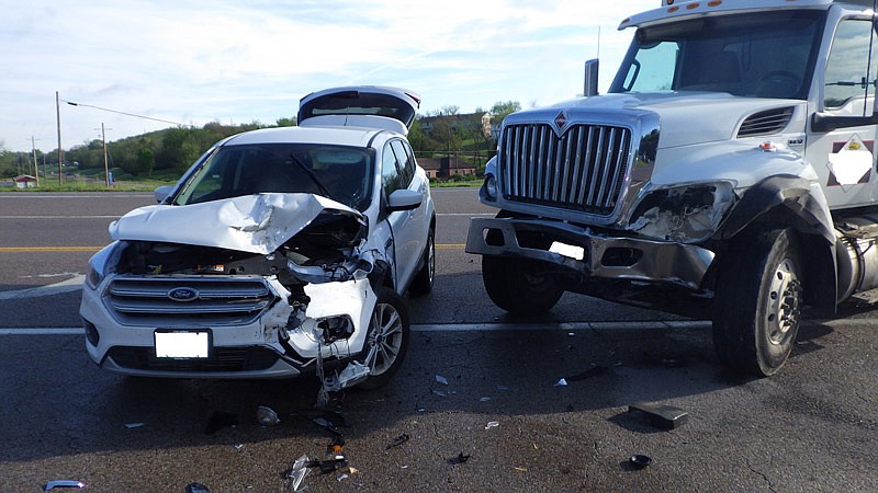 This photo provided by the Jefferson City Police Department shows two of four vehicles involved in a crash Monday morning, May 3, 2021, at the intersection of Route B and Lorenzo Greene Drive. Four people were injured in the wreck.