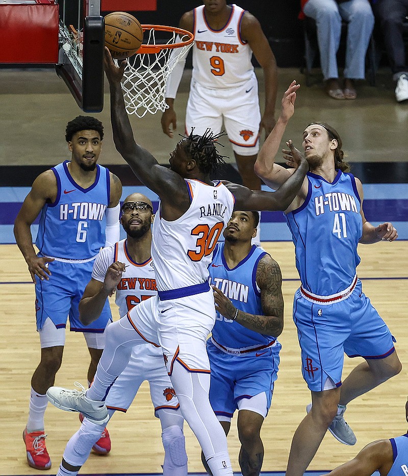 New York Knicks forward Julius Randle (30) shoots the ball as Houston Rockets forward Kelly Olynyk (41) defends during the first quarter of an NBA basketball game in Houston, Sunday, May 2, 2021. (Troy Taormina/Pool Photo via AP)