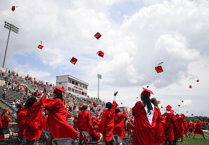 Liv Paggiarino/News TribuneJefferson City High School’s graduates throw their caps into the air to conclude their commencement ceremony on Saturday, Aug. 1, 2020 at Adkins Stadium. 