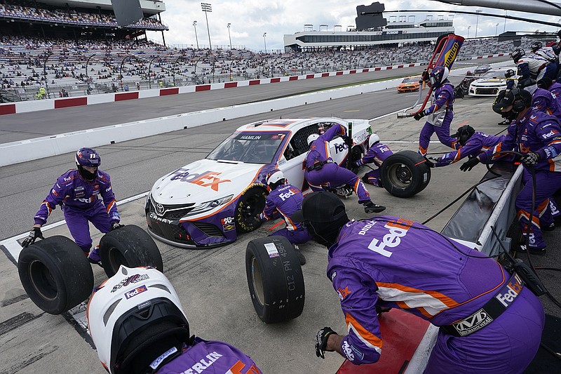 Denny Hamlin gets service in the pits last month during the NASCAR Cup Series race at Richmond International Raceway in Richmond, Va.