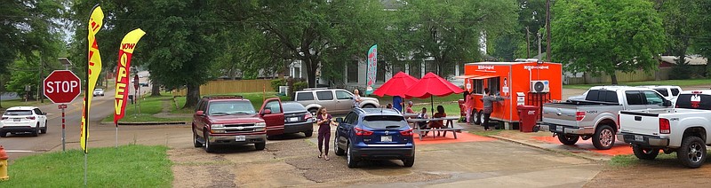 This busy scene was typical last week with the opening of a food truck in Atlanta at the corner of North Louise and West Allday streets. Louise Street is one of the busiest in the city and was once U.S. Highway 59 through the town.