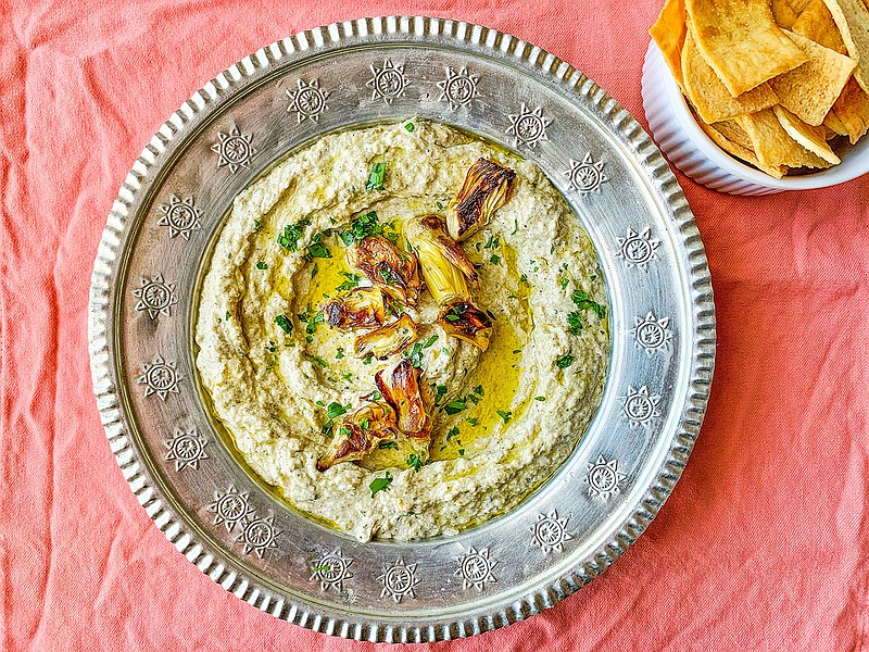 Grilled and marinated artichokes make quick work of this simple dip, enriched with tahini, cumin and lemon juice. (Ben Mims/Los Angeles Times/TNS)